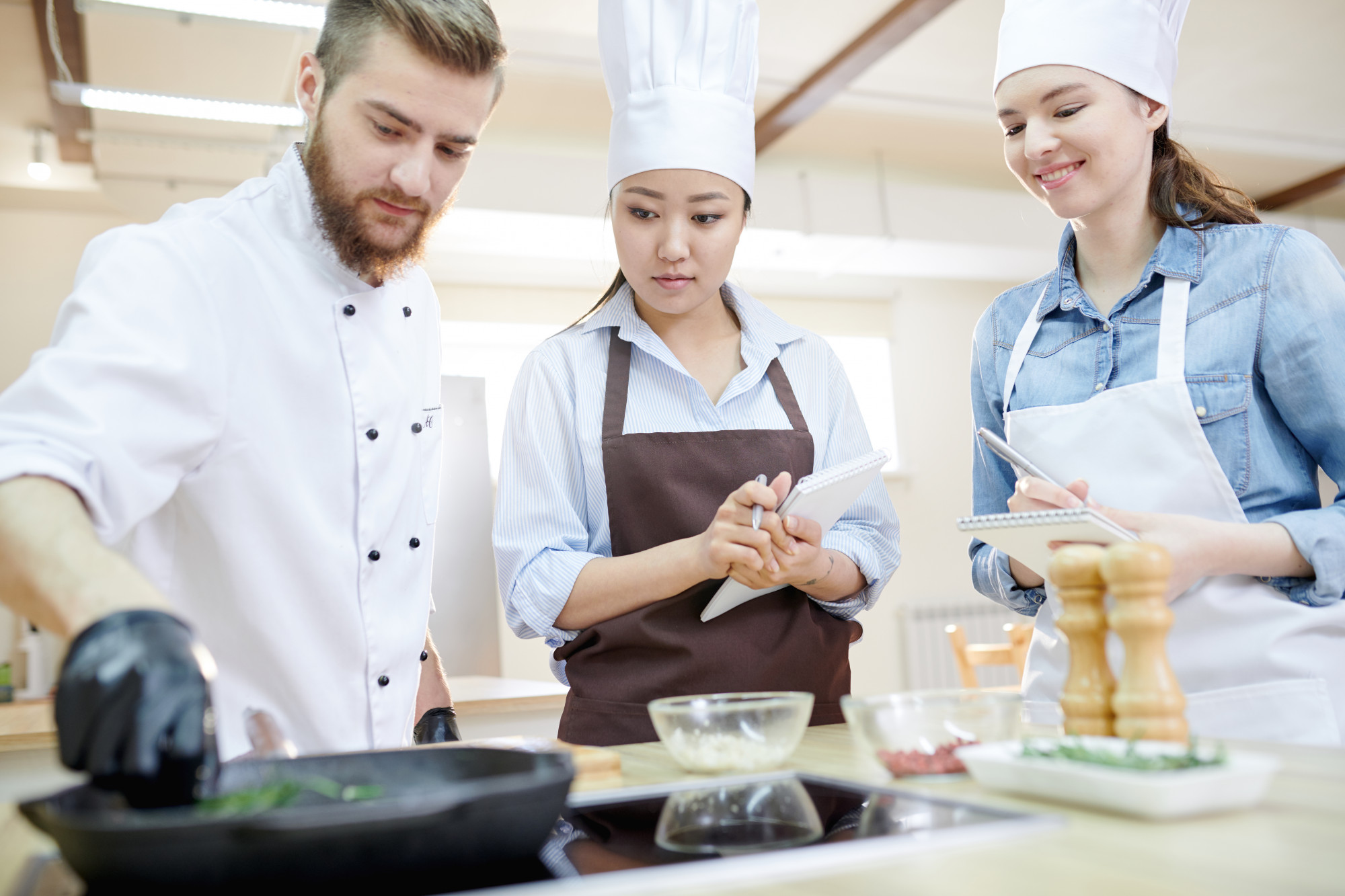 Wide view of a workshop kitchen with students